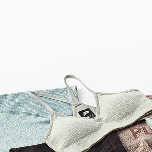 Flatlay of pursue fitness clothing on a white board